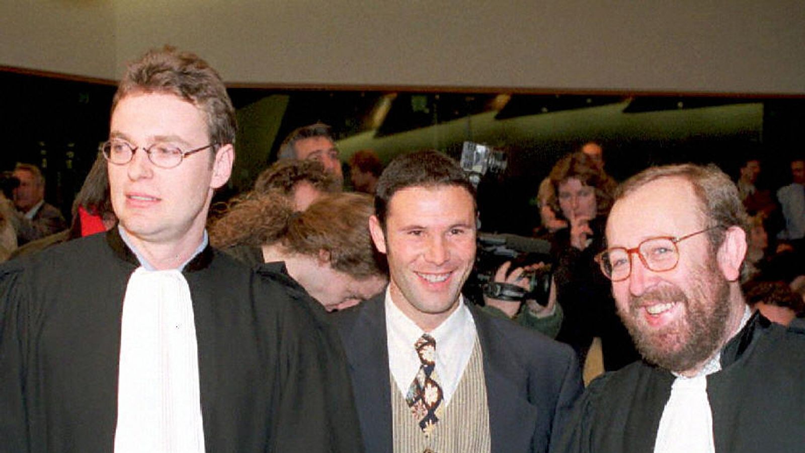 Jean-Marc Bosman with his lawyers Luc Misson and Jean-Louis Dupont after the ruling.